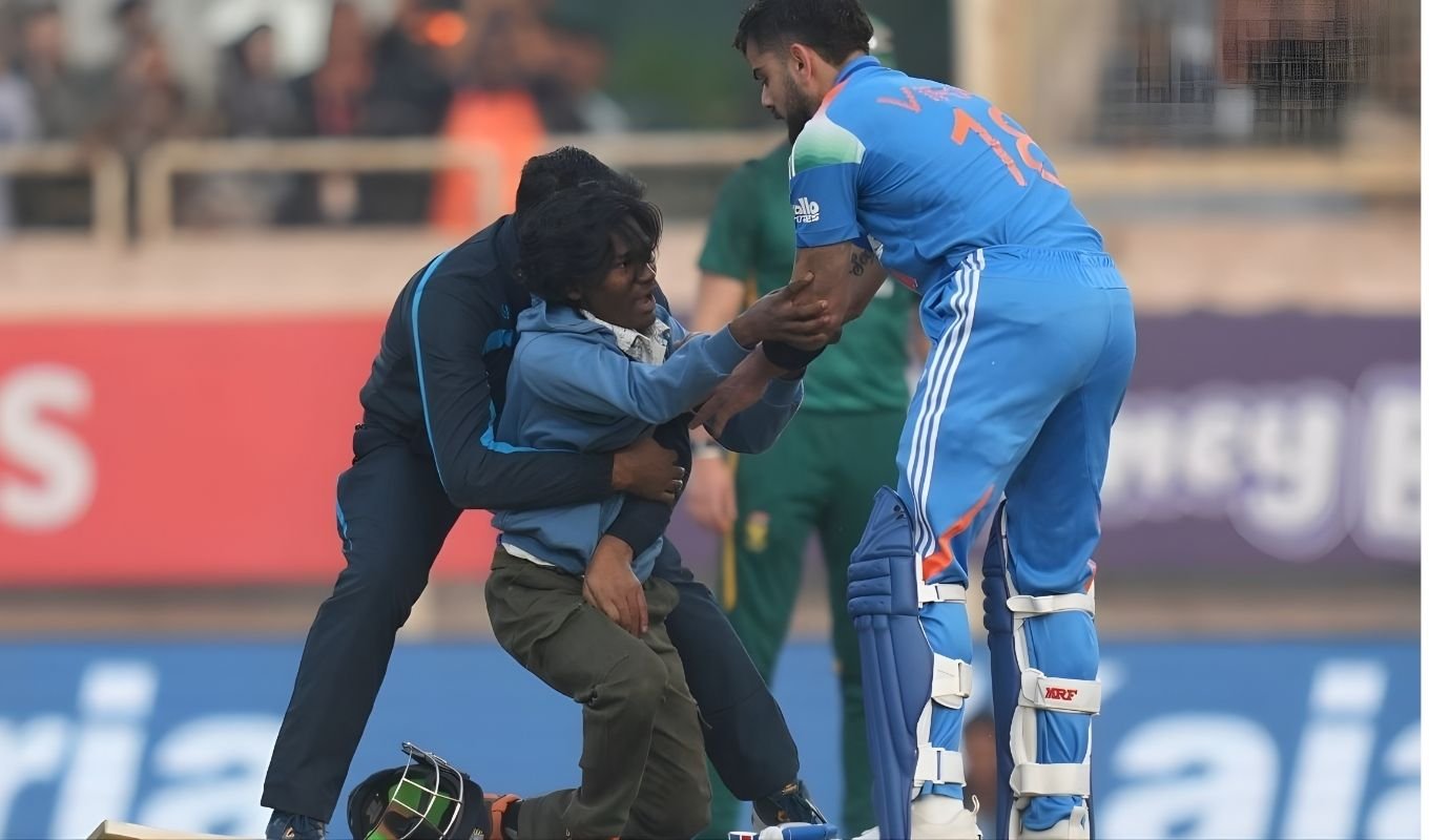 A Fan Rushes Onto the Field Immediately After Kohli’s Century
